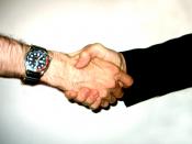 English: Two persons shaking hand