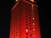 UT Austin Tower lit entirely in orange to celebrate a significant athletic victory or campus-wide accolade