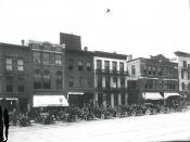 Automobiles lined up on Main St