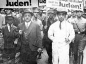 English: During the boycot of Jews on april 1, 1933 in Nazi-Germany jews are forced to march with anti-semitic signs. The men in uniform are SA-members. The signs say things like: 