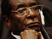 Original caption: President of Zimbabwe Robert Mugabe listens as Prof. Alpha Oumar Konare, chairman of the Commission of the African Union, addresses attendees at the opening ceremony of the 10th Ordinary Session of the Assembly during the African Union S