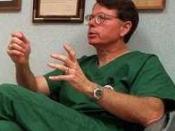 Cropped from a news photo of George Tiller, Dr. Tiller gives a mock consultation in his clinic, Women’s Health Care Services, which he owned and operated in Wichita, Kansas from 1975 until his assassination in 2009