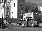 Phoenix, Arizona street in 1939. There were still lots of Model T's in use. Street scene shows parked and moving cars, church, and gas station.