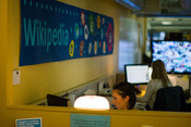 English: wikimedia foundation desks and workspace with images on screen