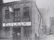 English: A photo of Eli Lilly and Company's original laboratory located at 15 W. Pearl St, Indianapolis, Indiana. Photo was taken in 1876. The two people on the right side of the doorway are Colonel Eli Lilly (the taller one) and his 14 year old son Josia