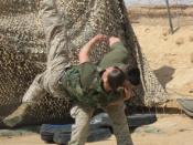 English: Two Marines from 2nd Marine Aircraft Wing (Fwd) practice Marine Corps Martial Arts Program at Al Asad, Iraq. Here, Corporal Robert Lemiszki performs the shoulder throw technique on Corporal Halie Kennie.