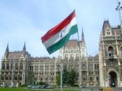 English: A flag from the 1956 Hungarian Revolution on the memorial to the victims located outside the Hungarian Parliament Building