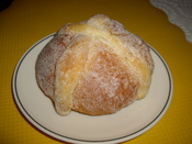 Image from Mexican pan de muerto. Title is in Nahuatl as a translation of pan de muerto to that language.