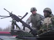 A soldier of the 174th Infantry Brigade trains a reservist on convoy duty at Fort Drum, New York.