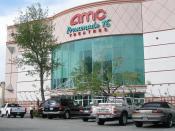 English: AMC Theatres Promenade 16, a 16-auditorium movie theater or multiplex. It is located at Westfield Shoppingtown Promenade, a shopping center in Woodland Hills. Photographed on May 19, 2006 by user Coolcaesar.