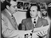 John Rosselli (right) checks over a writ of habeas corpus with his lawyer, Frank Desimone after Rosselli surrendered to the U.S. Marshall here yesterday...