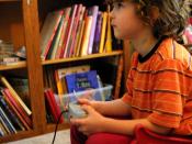 Young person playing with a GameCube