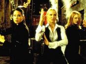 One of the most widely reproduced publicity images from Charlie's Angels features (L to R) Lucy Liu, Cameron Diaz, and Drew Barrymore in defensive posture as they prepare to subdue the Thin Man.
