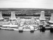 Viewed from the west, Three Mile Island currently uses only one nuclear generating station, TMI-1, which is on the left. TMI-2, to the right, has not been used since the accident. Note that this is a pre-accident photo taken when TMI-2 was in operation.