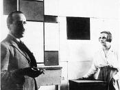 English: Anonymous. Piet Mondrian and Pétro (Nelly) van Doesburg in Mandrian's studio at Rue du Départ, Paris. 1923. Photo. Published (in altered form) in De Stijl, vol. VI, nr. 6/7 (1924): p. 86. Nederlands: Anoniem. Piet Mondriaan en Pétro (Nelly) van D