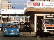 East Germans drive their vehicles through Checkpoint Charlie as they take advantage of relaxed travel restrictions to visit West Germany.