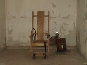 English: Original Death Chamber at the Red Hat Cell Block. The chair is a replica of the original. The Red Hat was closed in the early 1970s.