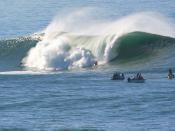 Surfers at Mavericks, a world-renowned big wave break a half mile off the coast of Half Moon Bay, California