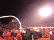 English: Utah Utes fans rush the field and carry the goalpost after defeating rival BYU, completing a perfect regular season, and becoming the first BCS Buster by clinching a spot in the 2005 Fiesta Bowl (hence the sombrero).