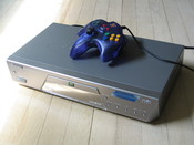 A Nuon DVD player with a video game controller