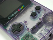 English: Nintendo Game Boy Color in the clear purple plastic casing.