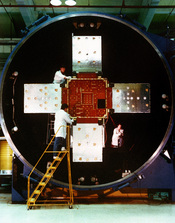 Technicians at the Naval Research Laboratory (NRL), work on the Low-powered Atmosphere Compensation Experiment satellite, which was developed by the NRL as part of its Strategic Defense Initiative (SDI) research. Location: WASHINGTON, DISTRICT OF COLUMBIA