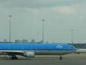 English: KLM Royal Dutch Airlines McDonnell Douglas MD-11 P PH-KCE at Amsterdam Schiphol Airport, in the background Danish Air Transport McDonnell Douglas MD-87 OY-JRU. Nederlands: KLM McDonnell Douglas MD-11 P PH-KCE op Luchthaven Schiphol (Amsterdam), o