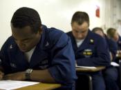 English: CORAL SEA (July 1, 2007) - Personnel Specialist 3rd Class Darryl Mitchell, from Dallas, takes a College Level Examination Program (CLEP) test on USS Kitty Hawk (CV 63). Sailors earn college credits for passing the exams, which are given on numero