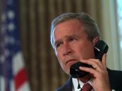 English: Bush speaking on the phone with Governor George Pataki and Mayor Rudolph Giuliani in a televised telephone conversation from the Oval Office on Sept. 13.