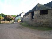 English: Leigh Barton. A complex of massive old barns and farmhouse in the Brendon Hills. One of the barns has been converted to a business selling wood burning stoves.