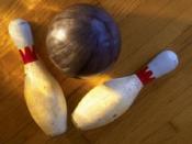 A plastic ball and two bowling pins.