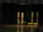 Unlike in ten-pin bowling, fallen pins are not cleared away between balls during a player's turn.