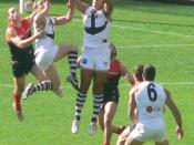 Matthew Pavlich flies for a mark in an AFL game against Melbourne