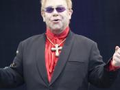 English: Elton John, English singer-songwriter and pianist, on stage at the Keepmoat Stadium, Doncaster, England.