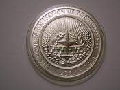 English: Sovereign Nation of the Shawnee Tribe (Oklahoma) - one Dollar coin. 2002. Reverse.
