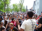 A slam poem is recited by Toussaint Morrison of the Minneapolis band The Blend for a crowd at the 2007 Mifflin Street Block Party.