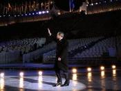 English: President George W. Bush waves to the crowd as he walks across the ice during the opening ceremonies for the 2002 Winter Olympic Games in Salt Lake City, Utah