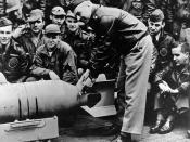 English: LtCol James H. Doolittle, USAAF Doolittle Raid on Japan, April 1942 Lieutenant Colonel James H. Doolittle, USAAF (front), leader of the raiding force, wires a Japanese medal to a 500-pound bomb, during ceremonies on the flight deck of USS Hornet 