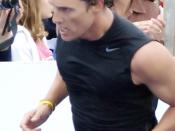 Matthew McConaughey approaching the finish line with determination. He finished fourth in the Male Celebrity Elite class, posting a time of 01:41:32.6.