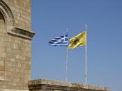 The byzantine flag, and the greek flag. Greek orthodox religion is religion of the state in Greece. These two flags are hoisted near every church in the country.