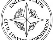 Illustration of the seal of the United States Civil Service Commission from Executive Order 11096, which defined the seal. The design is described there as: On a white background a four-pointed ridged gold star over a palm wreath in green with a gold tie,