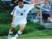 Us womans soccer legend Mia Hamm takes corner kick.