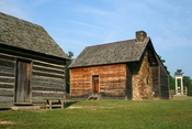 Bennett Place, a carefully reconstructed historic farm in Durham, North Carolina, the site of the largest surrender of Confederate soldiers during the American Civil War on April 26, 1865. Showing, from left to right, the kitchen, the farmhouse, and the m
