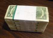 1000 United States two-dollar bills in shrink wrap.