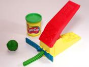 Green Play-doh with can and accessory toy (Play-doh is a trademark of Hasbro).