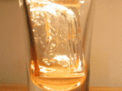 A time-lapse animation of icecubes melting in a glass (50 minutes).