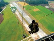Military static line jump, from the rear of a C-130 Hercules