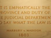 First Floor at the Statute of John Marshall, quotation from Marbury v. Madison (written by Marshall) engraved into the wall. United States Supreme Court Building.