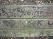 The bench in Viretta Park, Seattle, Washington, has been heavily graffitied as a de facto memorial to singer , who lived the last part of his life in a home directly adjacent to the park.