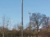 English: Big Brother is watching you! CCTV near Chalfont Common. The camera on the pole is actually looking along the M25 - but this type of camera in the countryside is just what was predicted by George Orwell in 1984. There is also a mobile phone transm